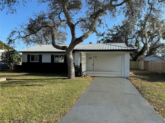 ranch-style home with a front lawn