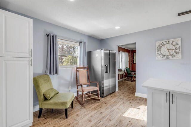 living area with light wood-type flooring