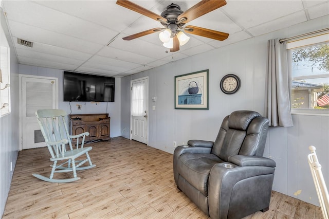 sitting room featuring a paneled ceiling, ceiling fan, and light hardwood / wood-style flooring