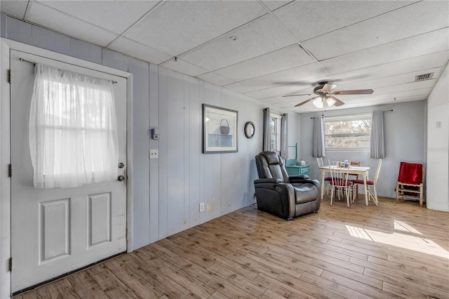 entryway with ceiling fan and light hardwood / wood-style floors