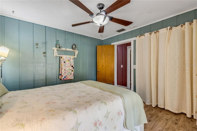 bedroom featuring ceiling fan and light wood-type flooring