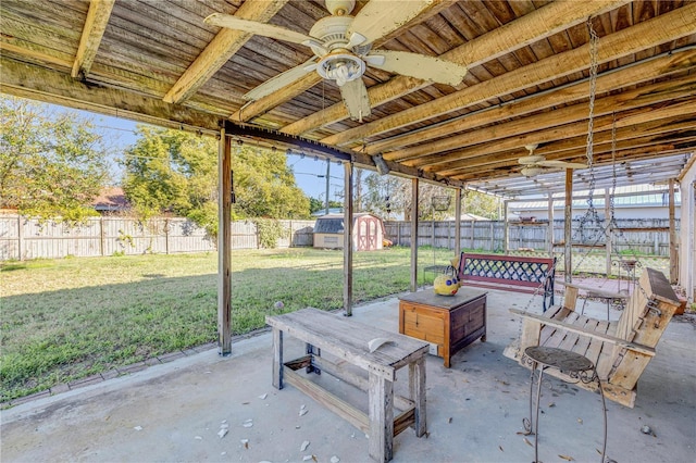 view of patio / terrace featuring a storage shed and ceiling fan