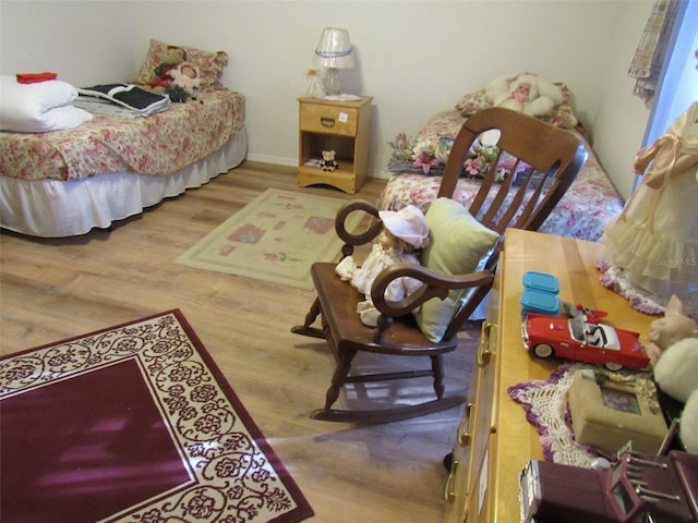 bedroom with hardwood / wood-style flooring