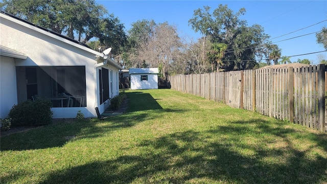 view of yard with a storage shed