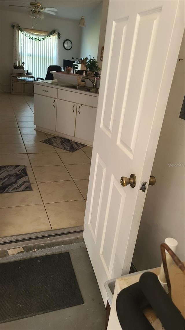 bathroom with ceiling fan, vanity, and tile patterned flooring