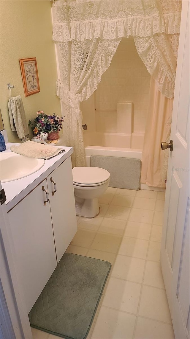 full bathroom with vanity, shower / tub combo, and toilet