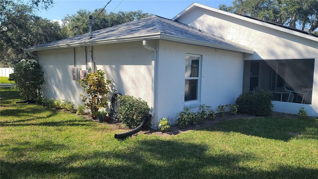 view of home's exterior with a yard