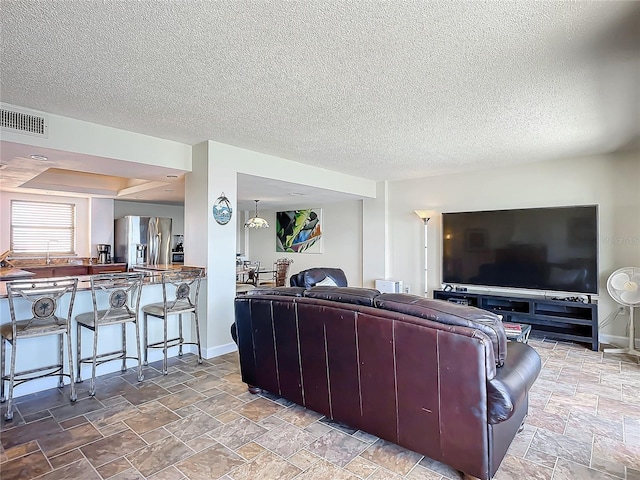 living room with a textured ceiling