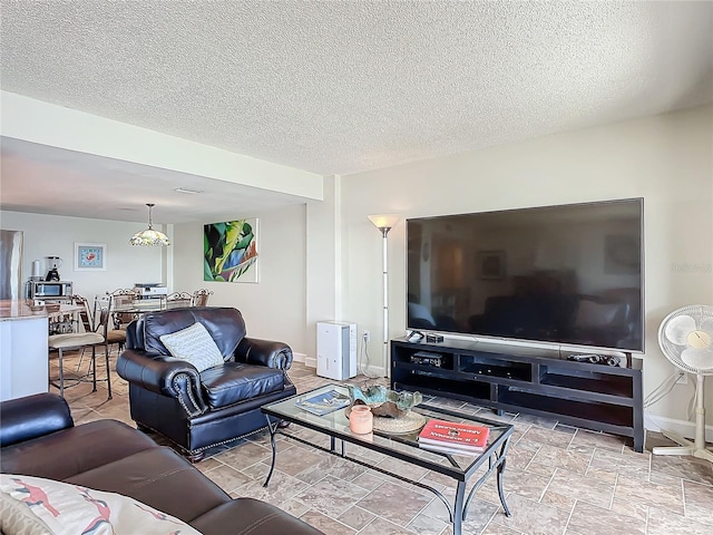 living room with a textured ceiling