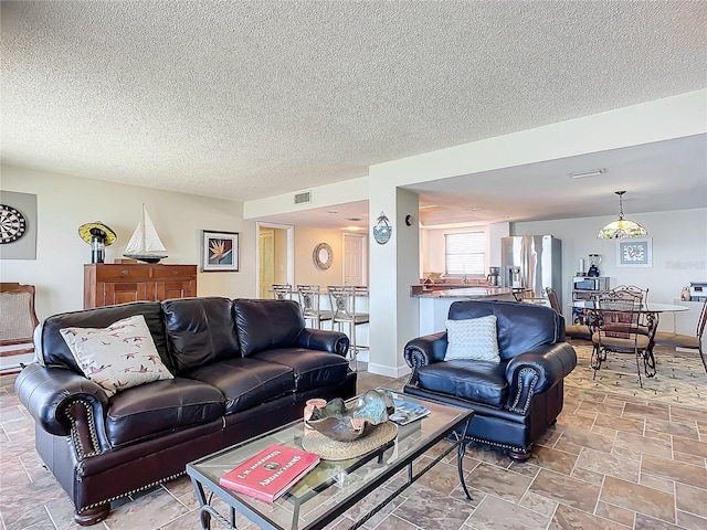 living room with a textured ceiling