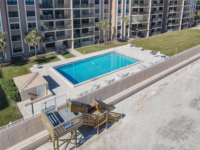 view of swimming pool with a patio area