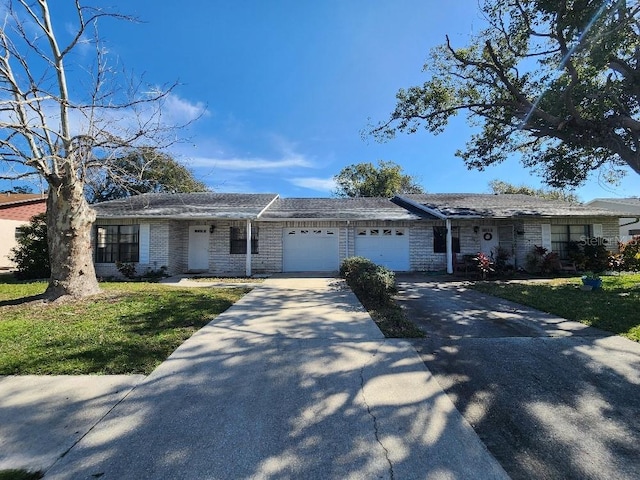 ranch-style house with a garage and a front yard