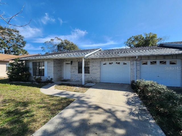 ranch-style home with a garage and a front yard