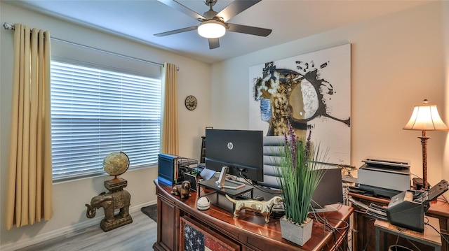 office area with hardwood / wood-style flooring and ceiling fan