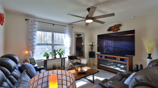 living room featuring light tile patterned floors and ceiling fan