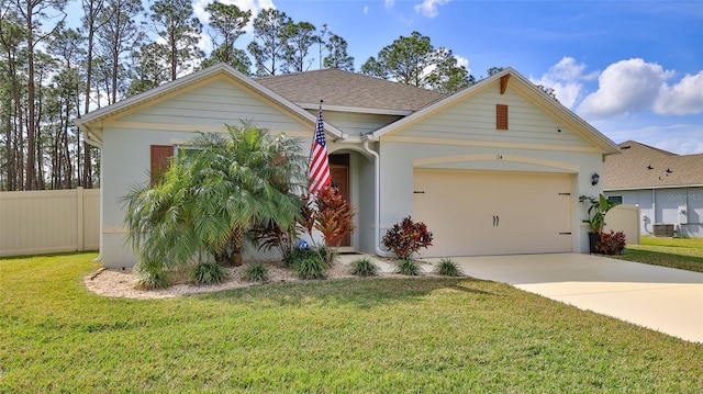 view of front of property with a garage and a front yard