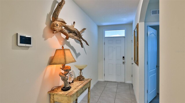 entrance foyer featuring light tile patterned floors