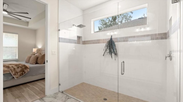 bathroom with ceiling fan and walk in shower