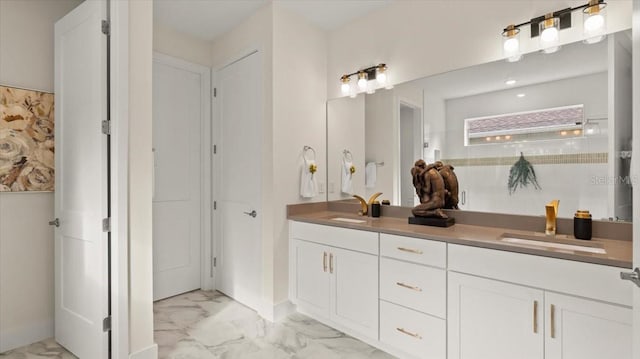 bathroom with vanity and a shower