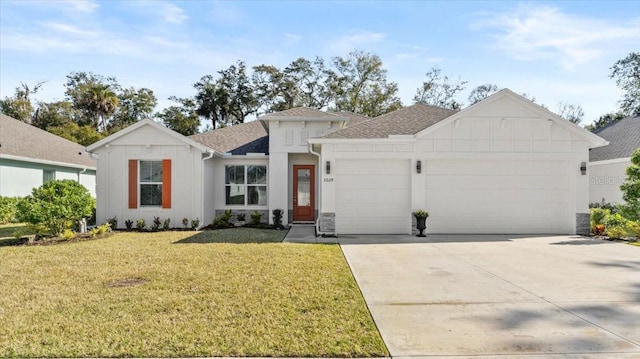 view of front of home featuring a garage and a front lawn