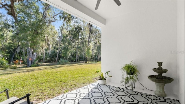 view of yard featuring ceiling fan