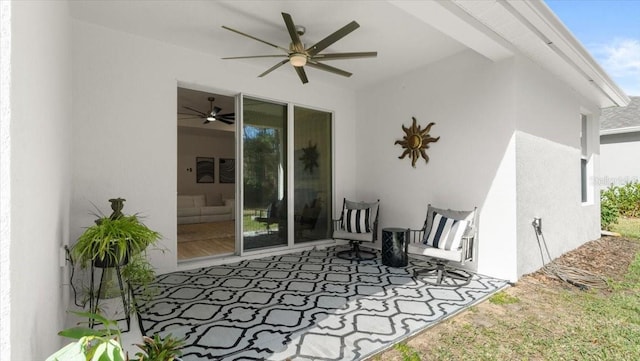 view of patio featuring ceiling fan