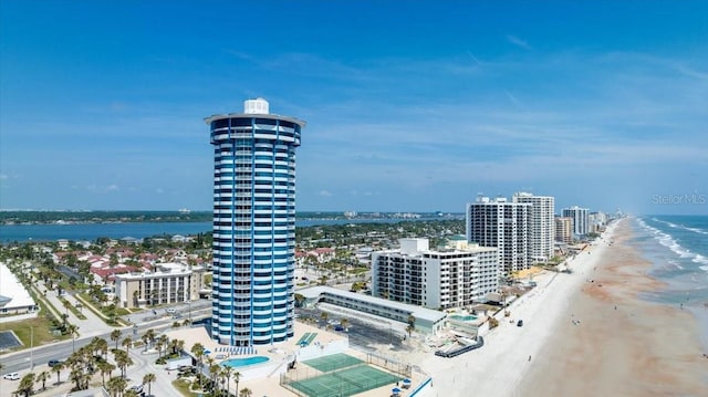 birds eye view of property featuring a view of the beach and a water view