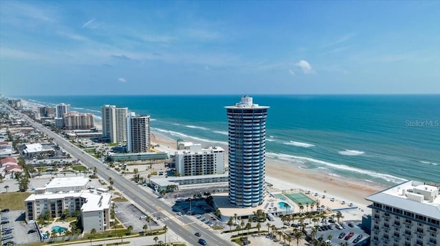 birds eye view of property with a view of the beach and a water view