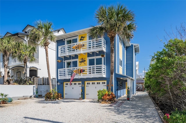 view of front of property with a balcony and a garage