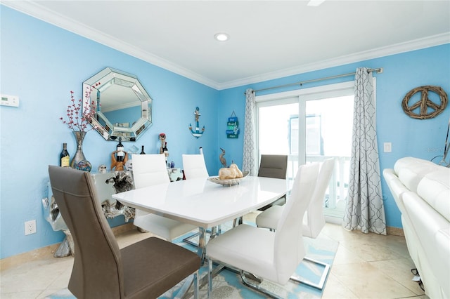 dining area with light tile patterned floors and crown molding