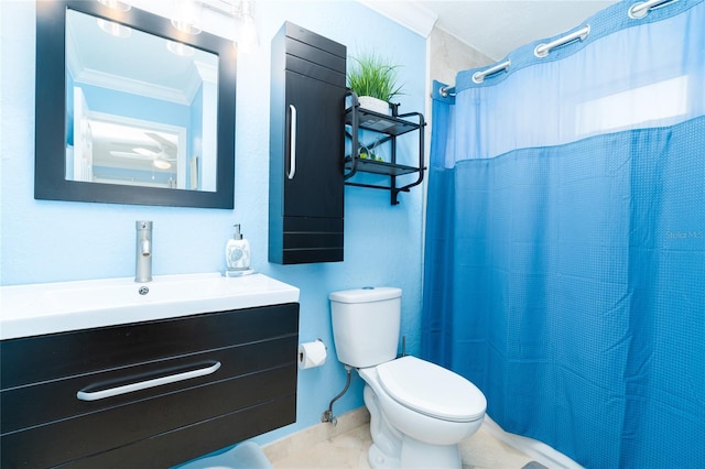 bathroom with tile patterned flooring, ornamental molding, vanity, toilet, and a shower with curtain