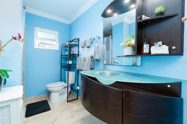 bathroom featuring crown molding, vanity, toilet, and tile patterned flooring