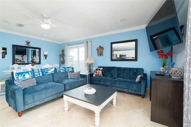 living room featuring ornamental molding and ceiling fan