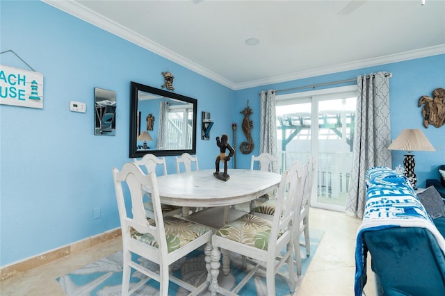 dining area featuring light tile patterned floors and crown molding