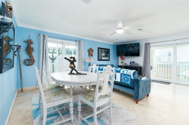 dining room with crown molding and ceiling fan