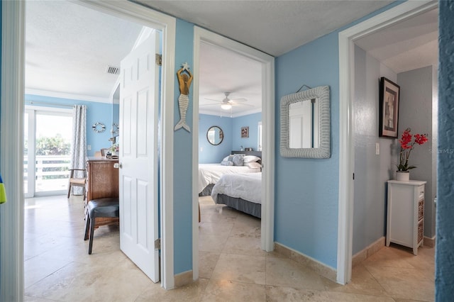 hallway featuring ornamental molding