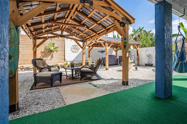 view of patio with area for grilling and a gazebo