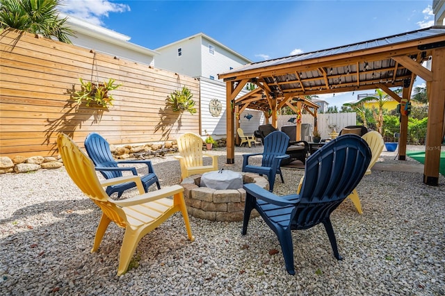 view of patio / terrace with a gazebo and an outdoor fire pit