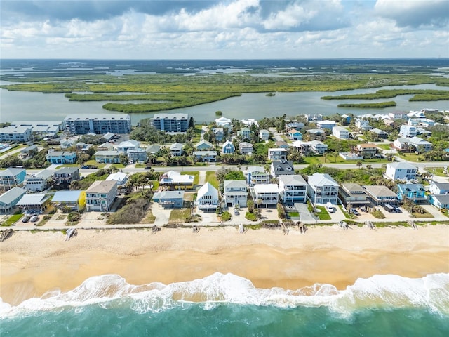 drone / aerial view with a view of the beach and a water view