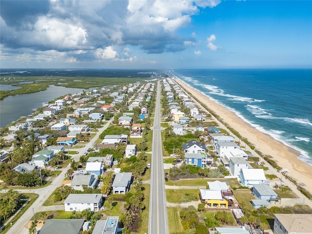 bird's eye view with a beach view and a water view