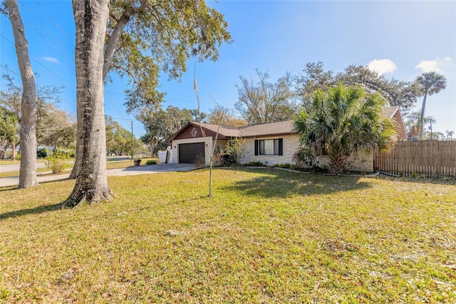 view of front of house with a garage and a front yard