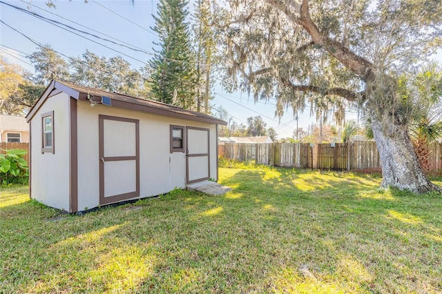 view of outbuilding featuring a yard