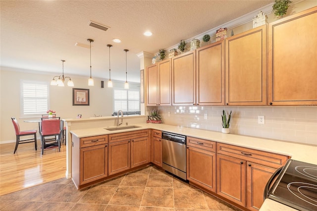 kitchen featuring sink, dishwasher, hanging light fixtures, range with electric stovetop, and kitchen peninsula