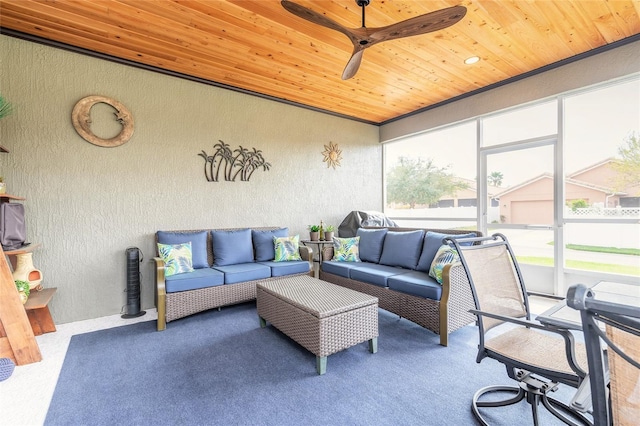 sunroom / solarium featuring wood ceiling and ceiling fan