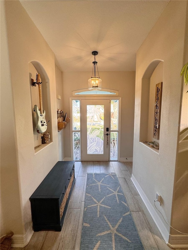 foyer entrance featuring hardwood / wood-style floors