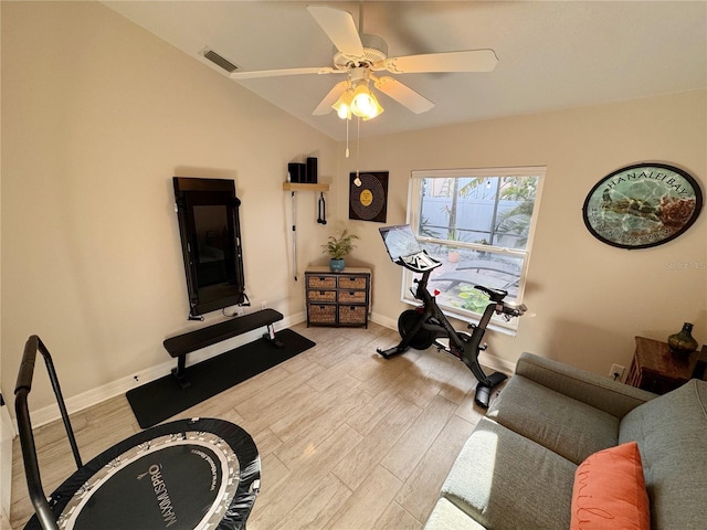 exercise area featuring vaulted ceiling, ceiling fan, and light hardwood / wood-style floors