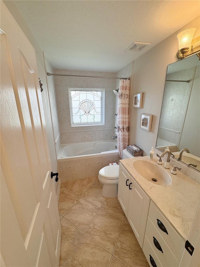 full bathroom featuring vanity, toilet, shower / tub combo, and a textured ceiling