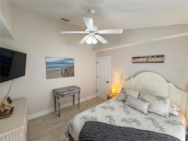 bedroom featuring vaulted ceiling, ceiling fan, and light hardwood / wood-style floors