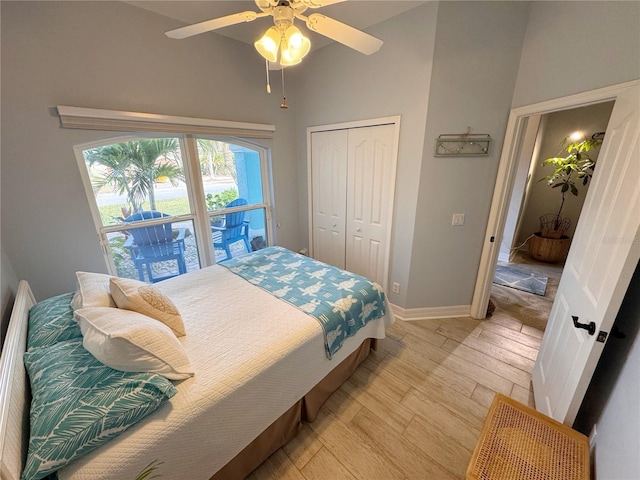 bedroom with ceiling fan, light hardwood / wood-style floors, and a closet