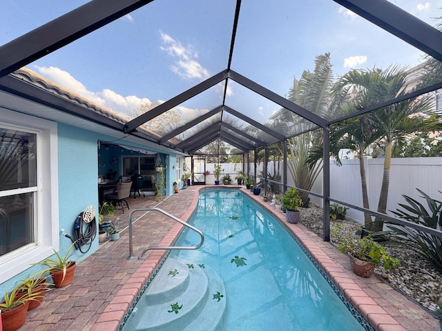 view of pool featuring a lanai and a patio area